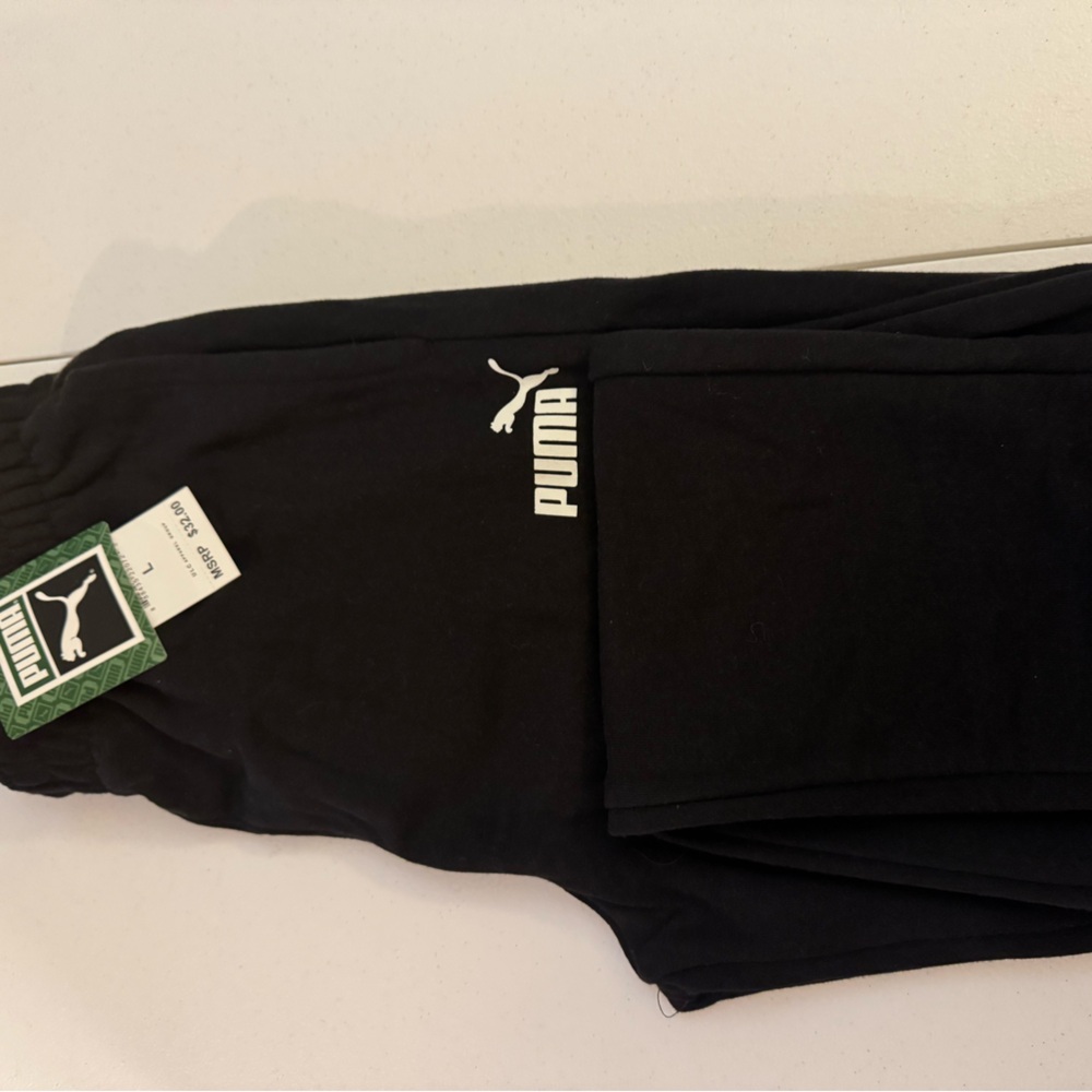 Boys black puma size large 14 sweat pants TVs with front pockets.